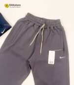 شلوار اسلش راسته مردانه پرنیا پارچه غواصی عمده طرح نایک رنگ مشکی و سرمه ای - تصویر 3